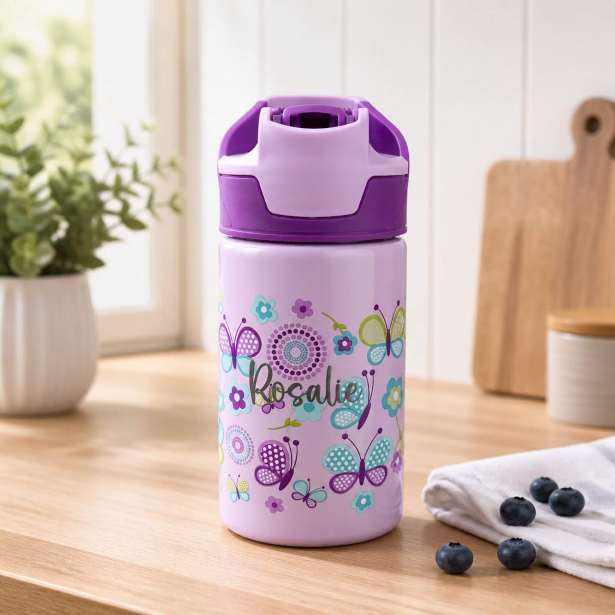 Personalised lilac kids water bottle with purple lid, featuring a butterfly and floral design and the name "Rosalie" — Little Cutlery Australia