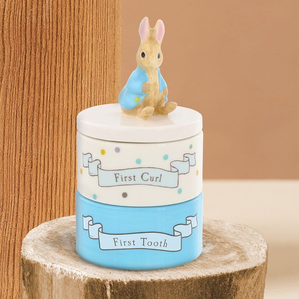 Peter Rabbit ceramic first tooth and first curl stacking keepsake box set in cream and blue with Peter Rabbit figurine lid topper, on white background