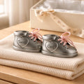 Russell Collection pewter baby first tooth and curl bootie keepsake set displayed on cream blanket - newborn baby shower gift with gift box in background, Little Cutlery Australia