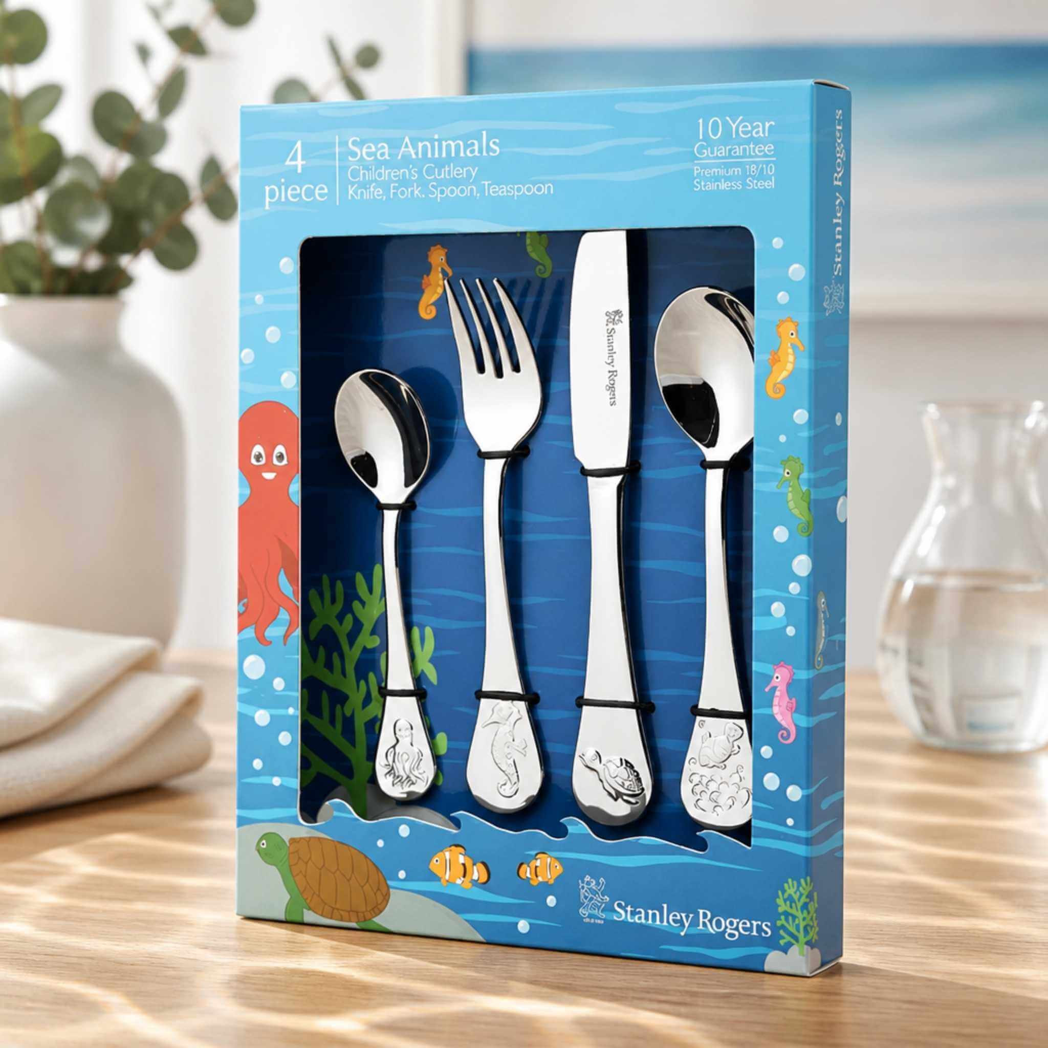 Stanley Rogers Sea Animals children's cutlery set 4 piece in gift box displayed on timber table - stainless steel kids cutlery with octopus seahorse turtle and fish design, Little Cutlery Australia