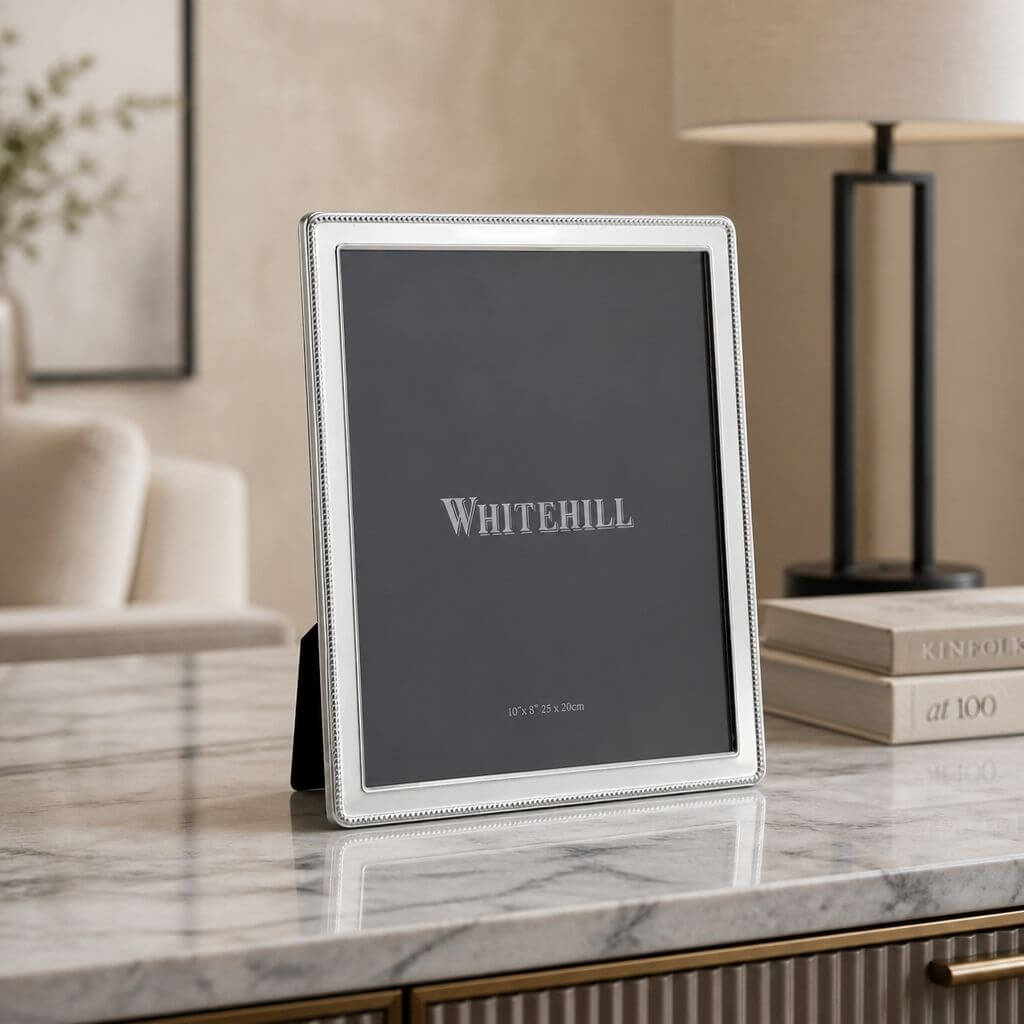 Whitehill Narrow Bead silver plated photo frame 10x8 inch displayed on marble surface - elegant tabletop easel frame in living room setting, Little Cutlery Australia
