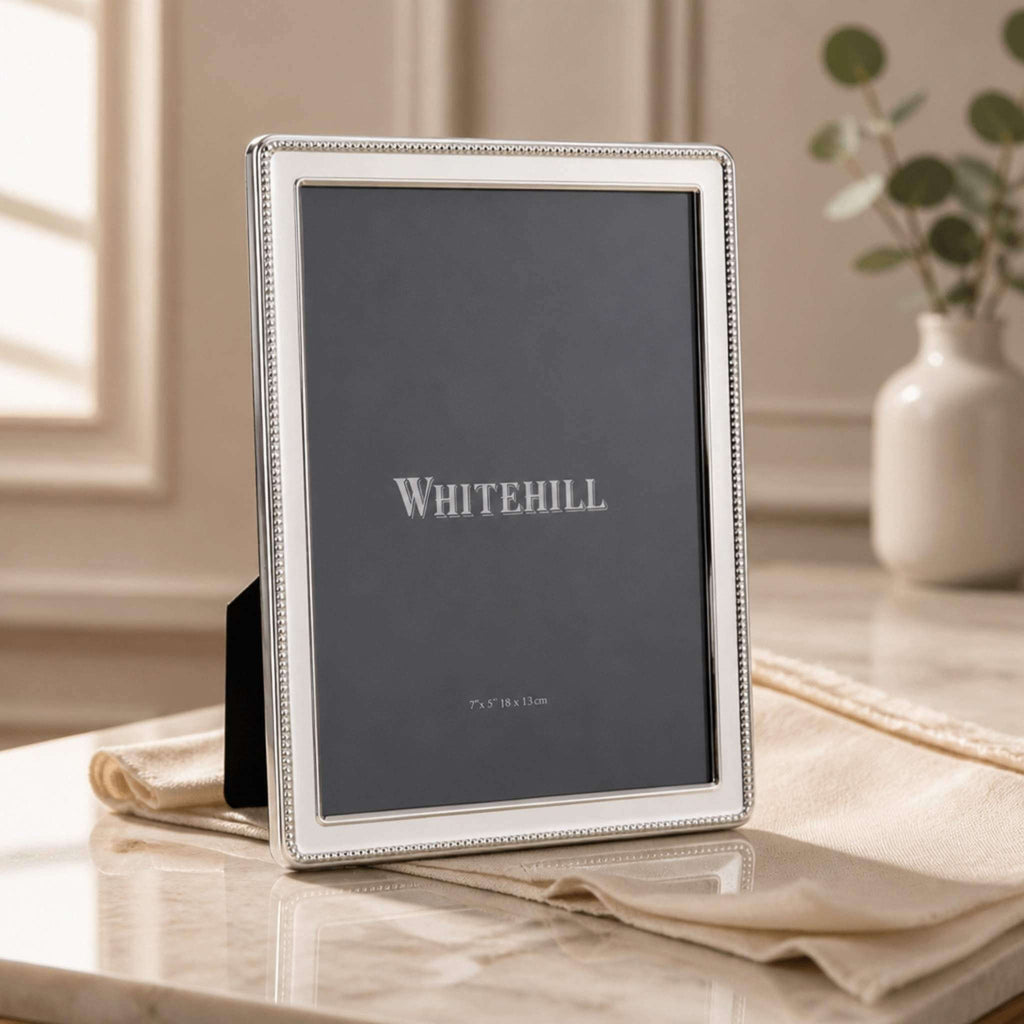 Whitehill Narrow Bead silver plated photo frame 5x7 inch displayed on marble surface with linen cloth - elegant tabletop easel frame with beaded border detail, Little Cutlery Australia