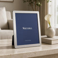 Whitehill Narrow Plain silver plated photo frame 10x8 inch displayed on marble surface with calla lily and Kinfolk book - elegant tabletop easel frame in living room setting, Little Cutlery Australia