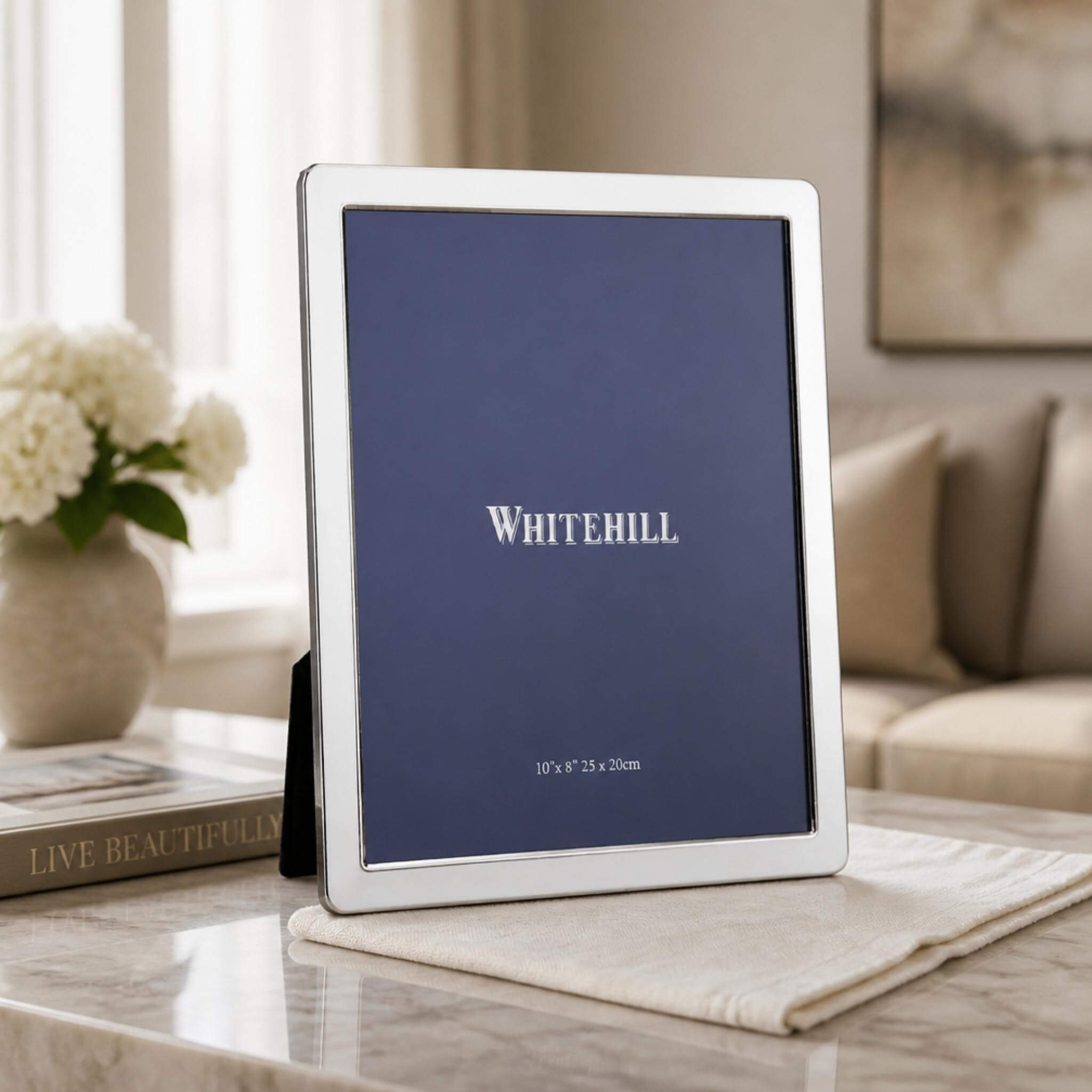 Whitehill Narrow Plain silver plated photo frame 10x8 inch displayed on marble surface - elegant tabletop easel frame in living room setting, Little Cutlery Australia