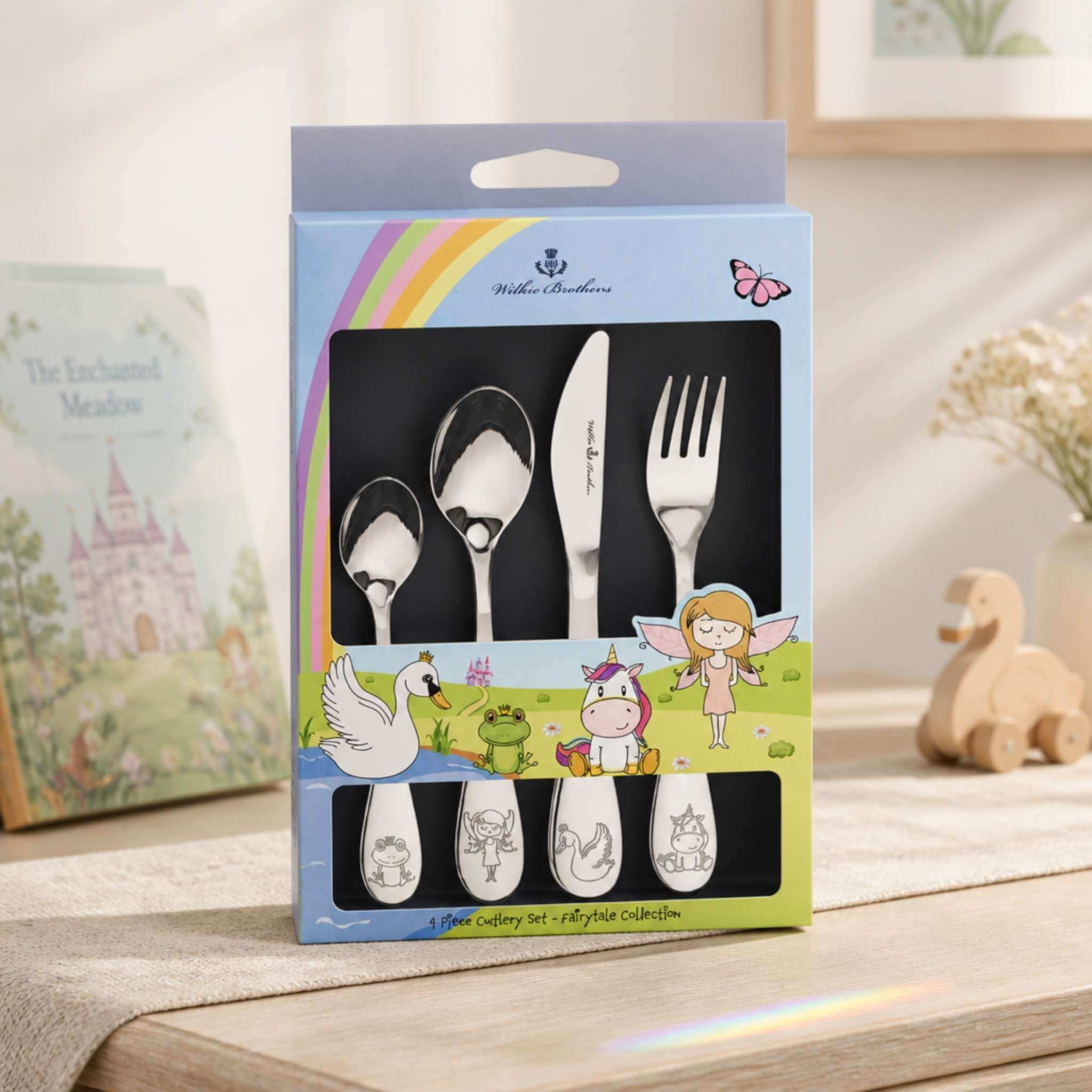 Wilkie Brothers Fairytale Collection children's cutlery set 4 piece in gift box displayed on timber table - stainless steel kids cutlery with fairy unicorn and frog prince design, Little Cutlery Australia